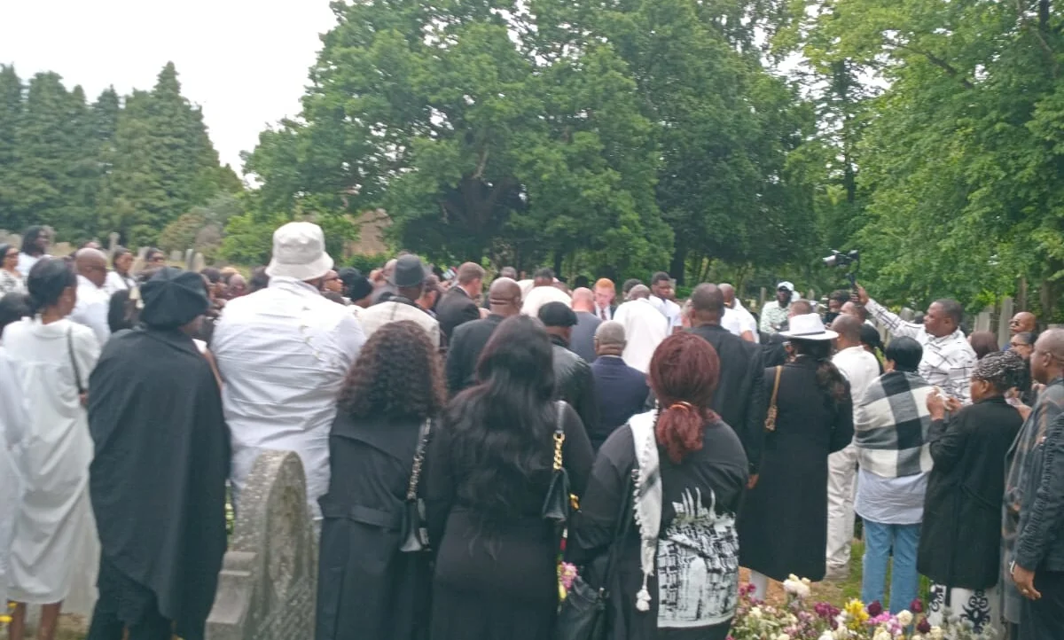 Members gathered at a graveside